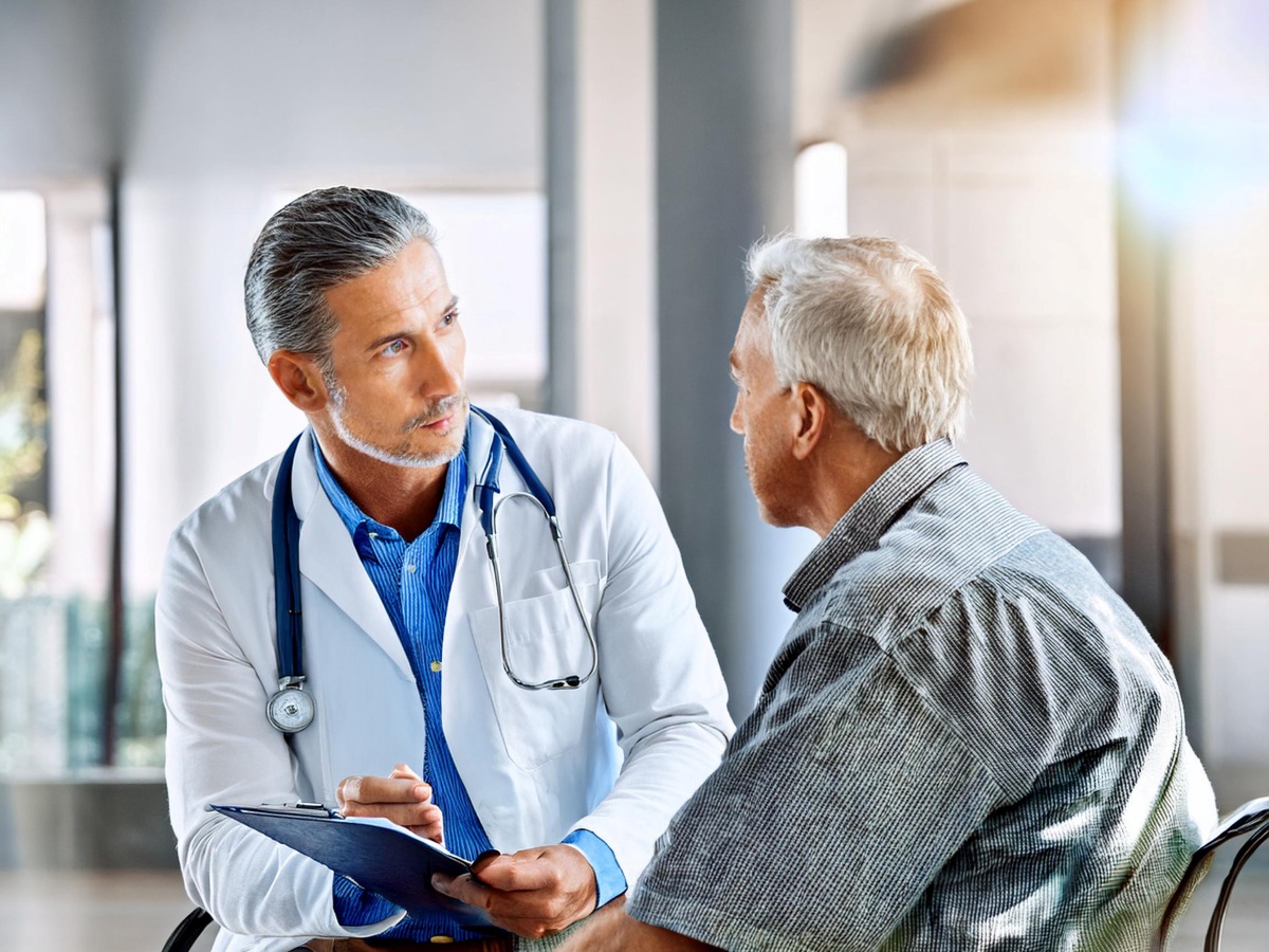 Doctor Showing Patient Chart to Patient